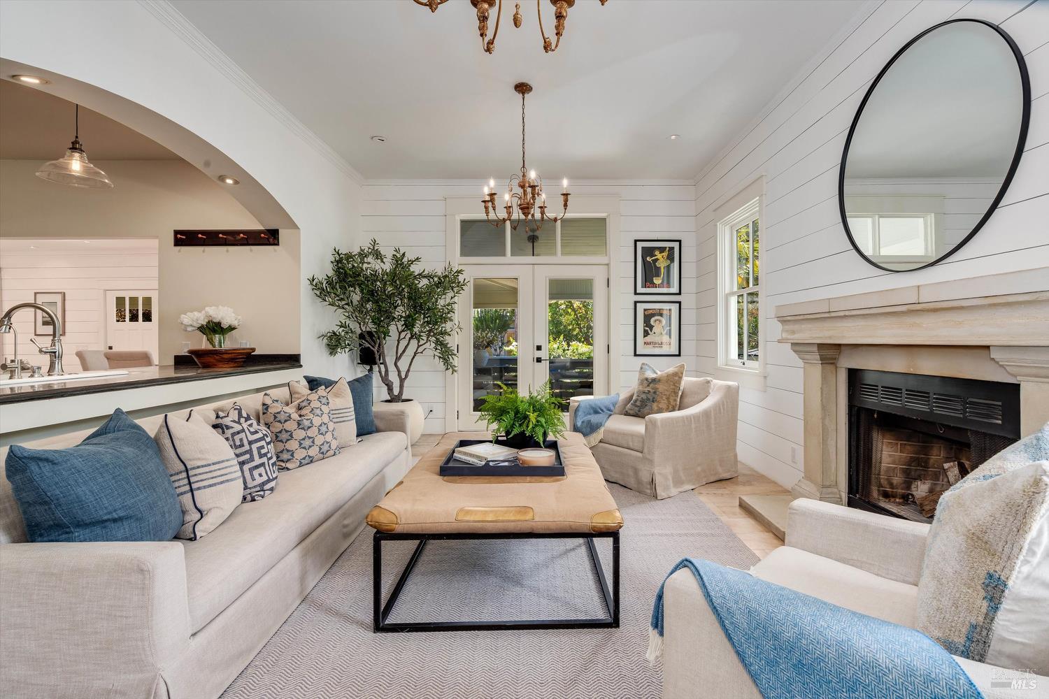 1243 Stockton Street St. Helena, CA 94574 - Photo 1 of 1 a living room with furniture a chandelier and a fireplace