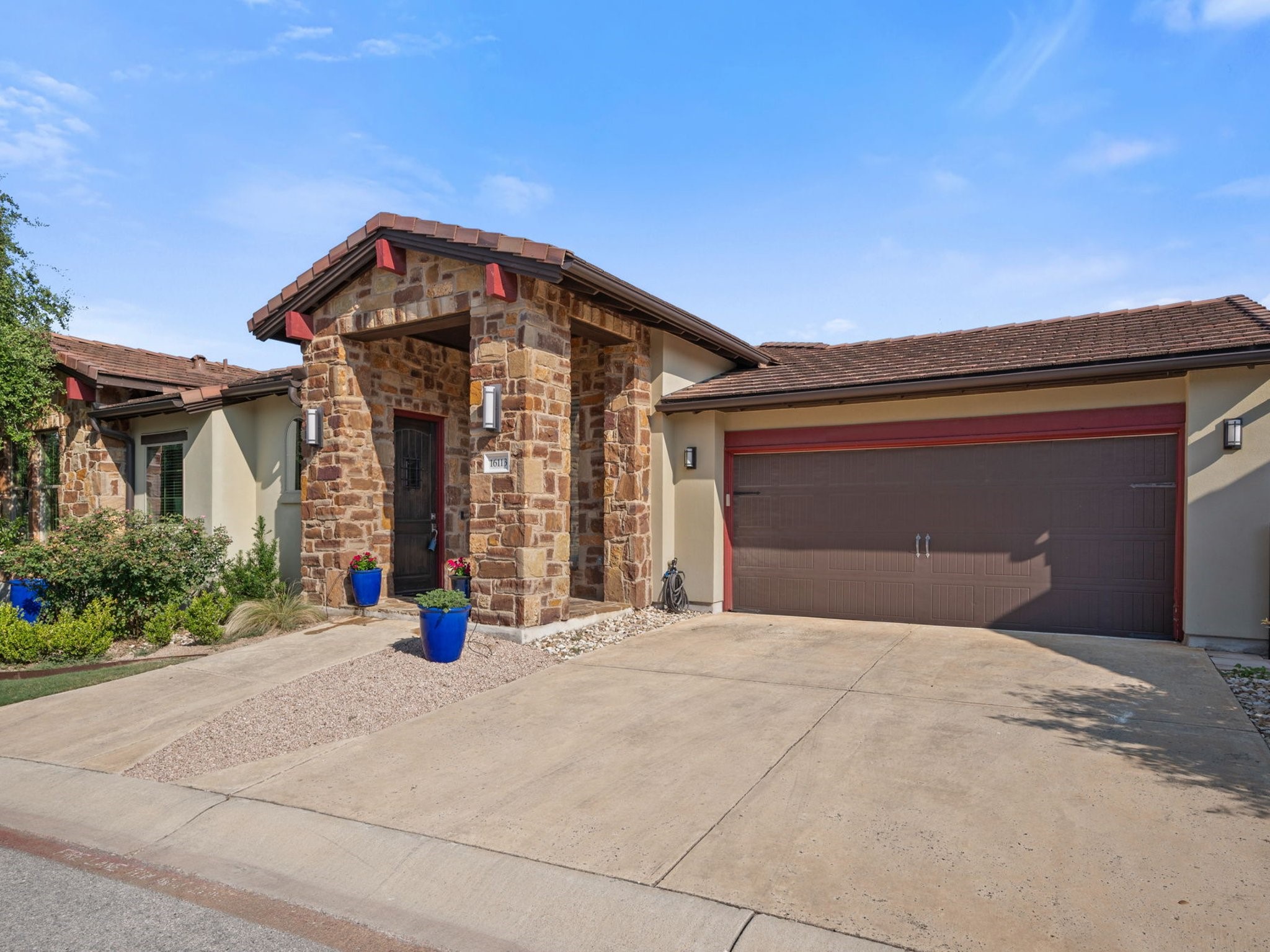16113 Goldstrum Trail, Unit 50 Austin, TX 78738 - Photo 1 of 1 a front view of a house with yard