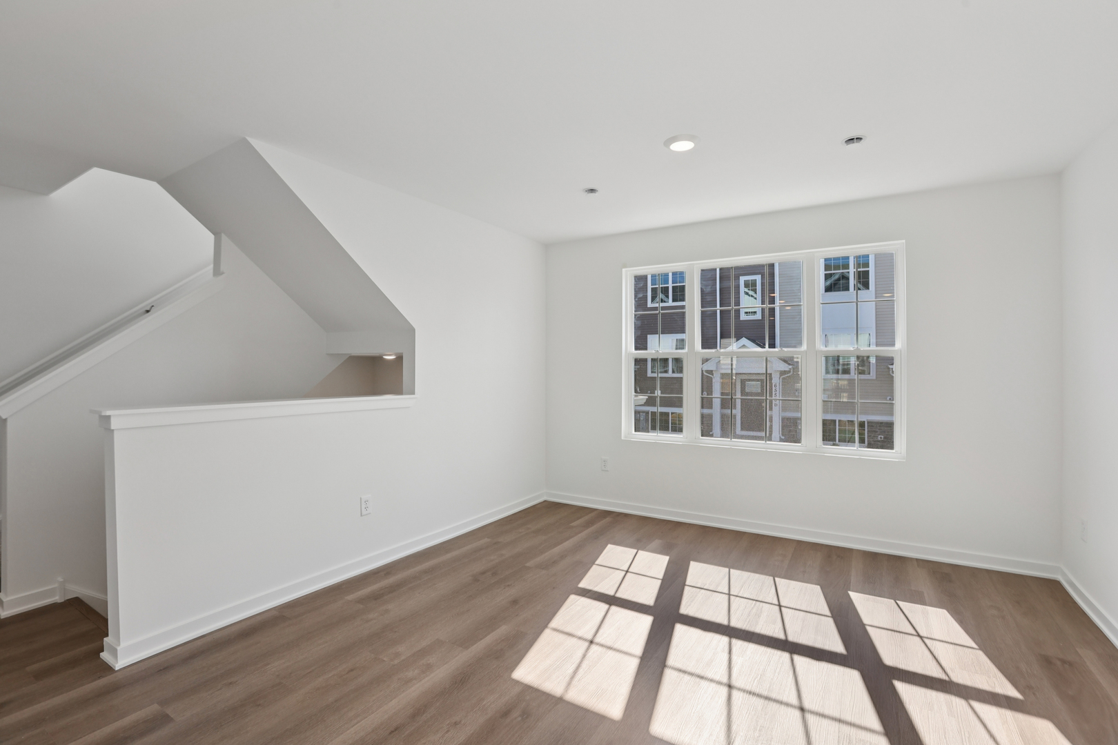 6510 Linden Trail, Unit C Wonder Lake, IL 60097 - Photo 13 of 24 a view of an empty room with wooden floor and a window
