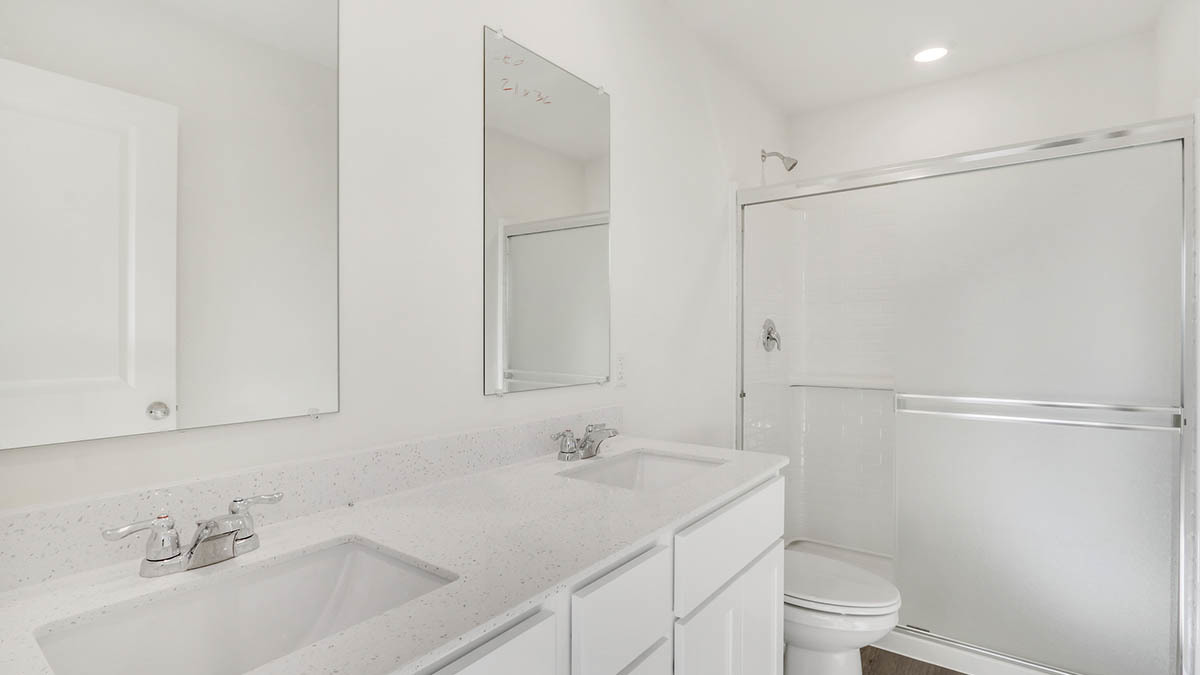 6510 Linden Trail, Unit C Wonder Lake, IL 60097 - Photo 22 of 24 a bathroom with a sink toilet and shower