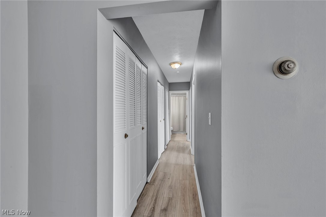 5200 Royalton Road, Unit 9B North Royalton, OH 44133 - Photo 14 of 27 Corridor featuring baseboards and light wood finished floors