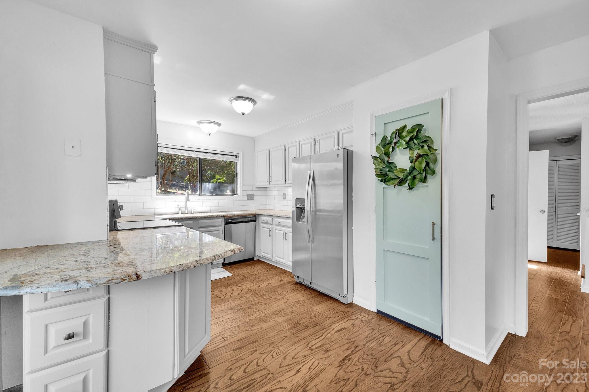 1016 Palmyra Drive Tega Cay, SC 29708 - Photo 12 of 33 a kitchen with stainless steel appliances granite countertop a refrigerator and a sink