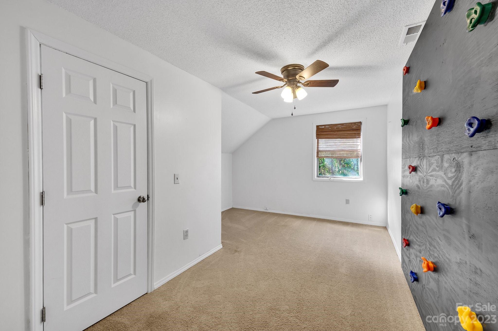 1016 Palmyra Drive Tega Cay, SC 29708 - Photo 18 of 33 a view of a livingroom with a ceiling fan