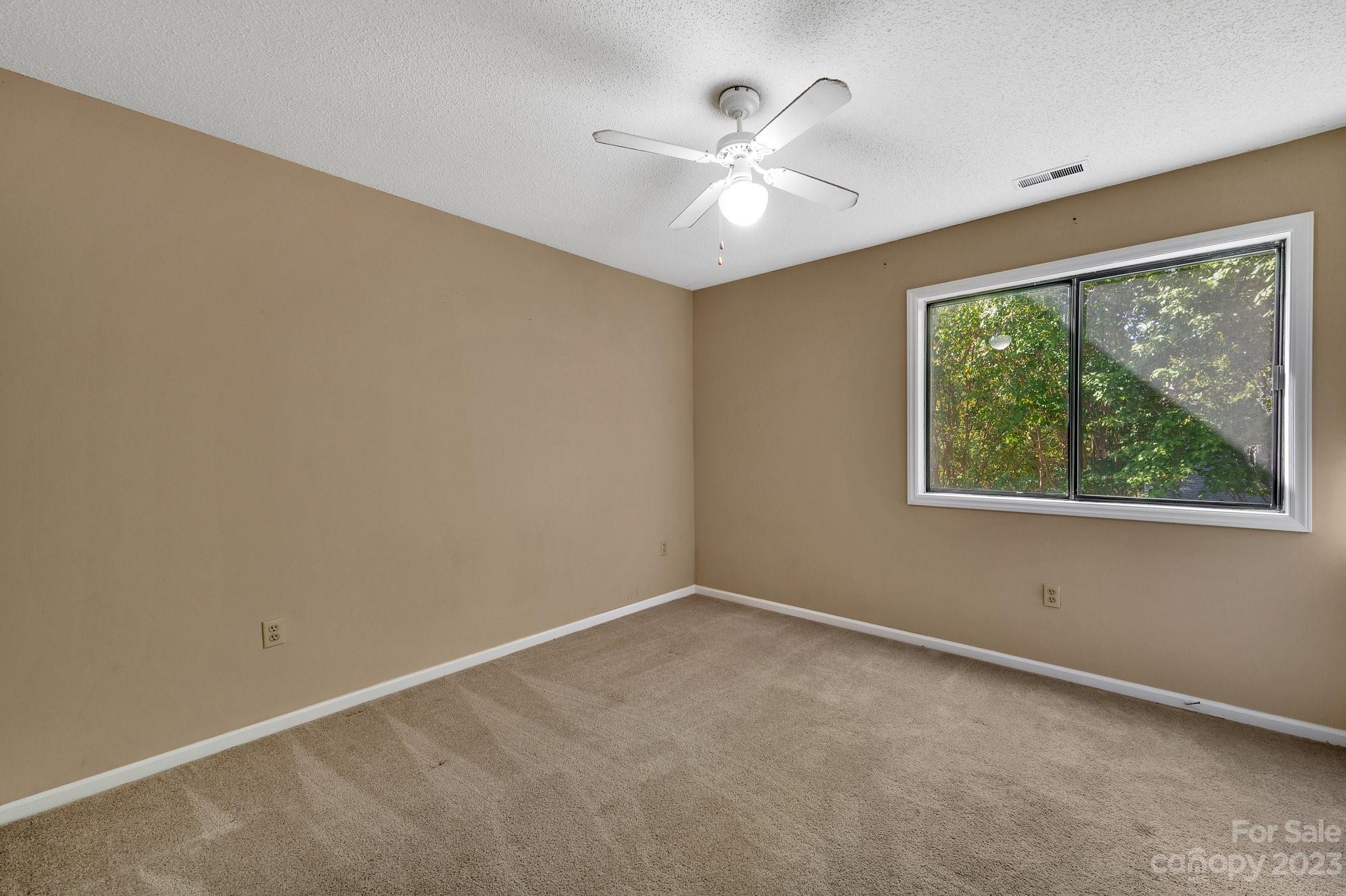 1016 Palmyra Drive Tega Cay, SC 29708 - Photo 20 of 33 an empty room with a window