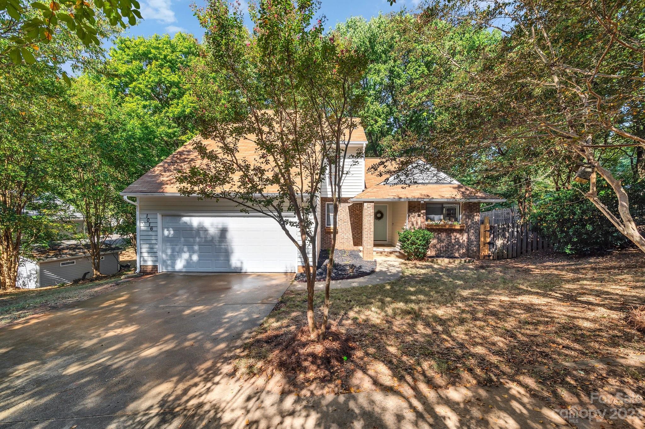 1016 Palmyra Drive Tega Cay, SC 29708 - Photo 2 of 33 a view of a house with a tree in the background