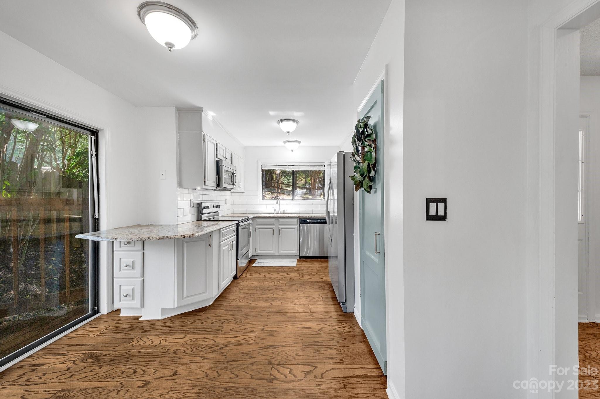 1016 Palmyra Drive Tega Cay, SC 29708 - Photo 10 of 33 a view of a kitchen with a sink and cabinets