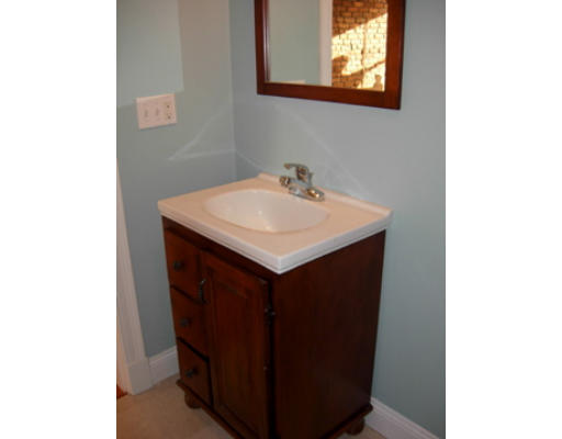 134 Marcella Street, Unit 2 Boston, MA 02119 - Photo 11 of 12 a utility room with a sink and a mirror