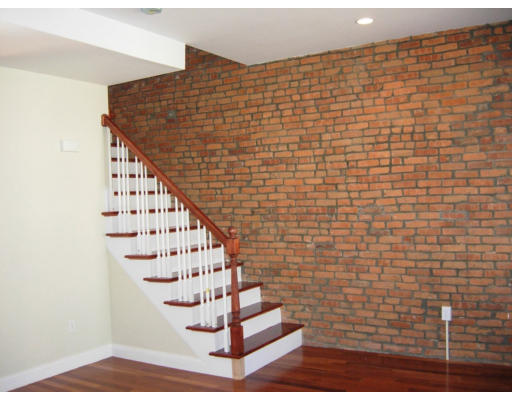 134 Marcella Street, Unit 2 Boston, MA 02119 - Photo 6 of 12 a view of entryway with wooden floor