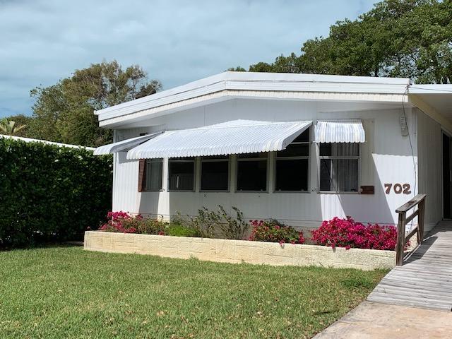 702 North Silver Circle Key Largo, FL 33037 - Photo 2 of 38 a front view of a house with entryway