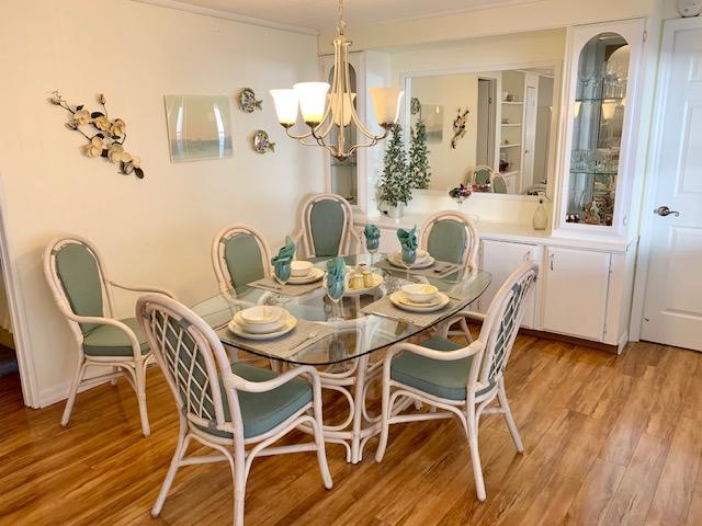 702 North Silver Circle Key Largo, FL 33037 - Photo 15 of 38 a view of a dining room with furniture and wooden floor