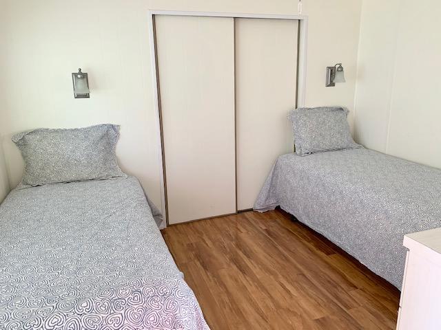 702 North Silver Circle Key Largo, FL 33037 - Photo 17 of 38 a bedroom with a bed and a night stand