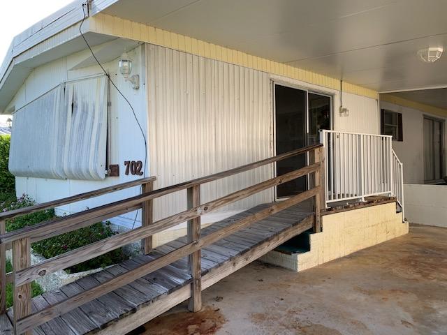 702 North Silver Circle Key Largo, FL 33037 - Photo 3 of 38 a view of entryway with wooden floor