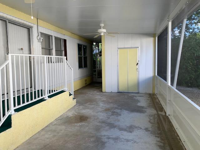 702 North Silver Circle Key Largo, FL 33037 - Photo 22 of 38 a view of a porch with wooden floor and stairs