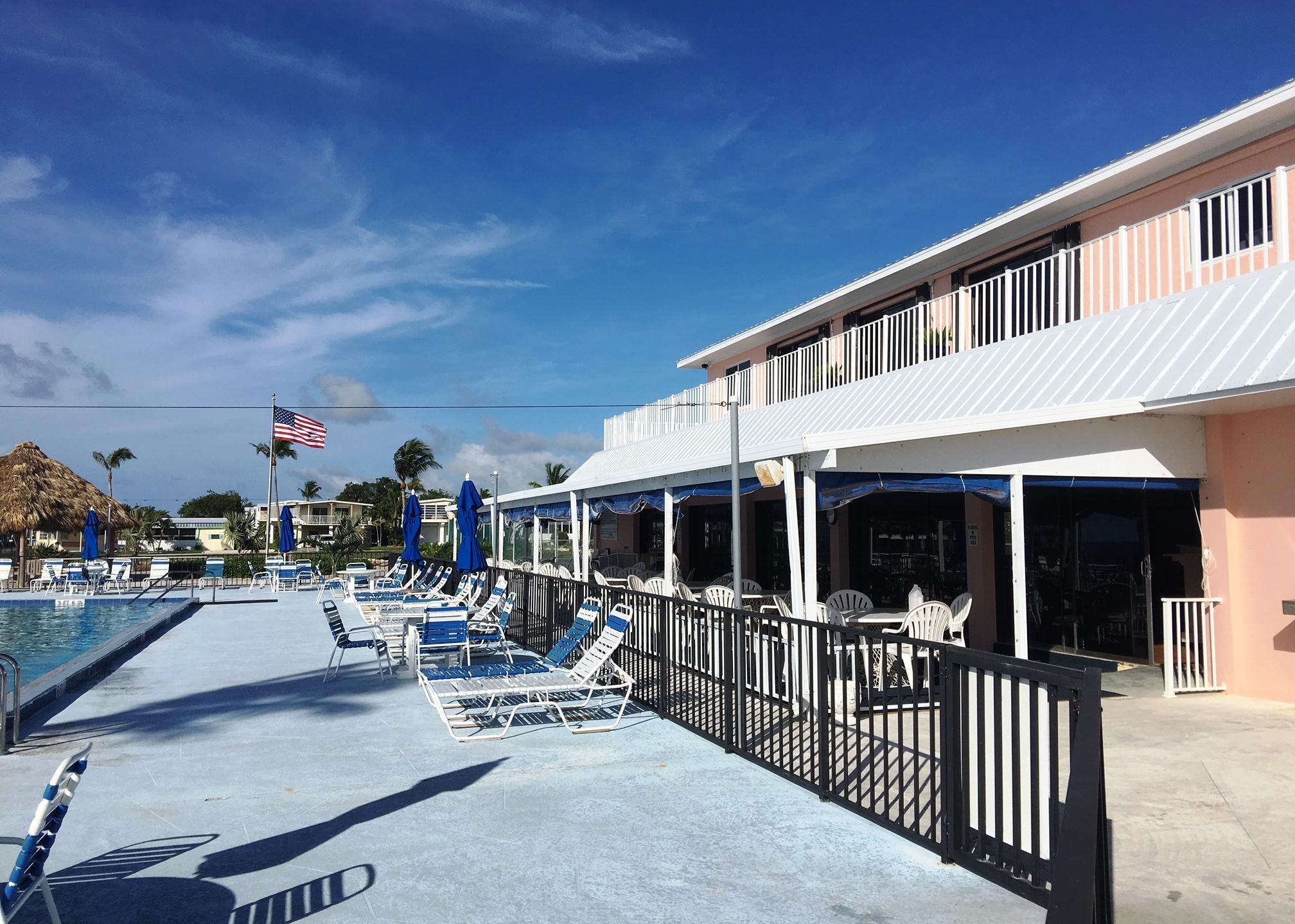702 North Silver Circle Key Largo, FL 33037 - Photo 25 of 38 a view of a patio with a table and chairs
