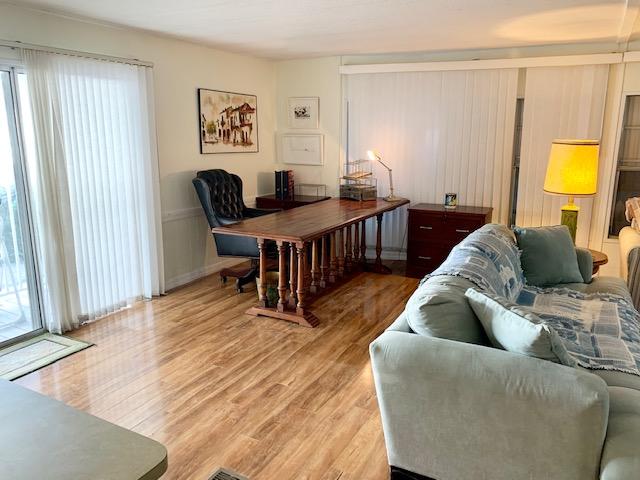 702 North Silver Circle Key Largo, FL 33037 - Photo 4 of 38 a living room with furniture and a wooden floor