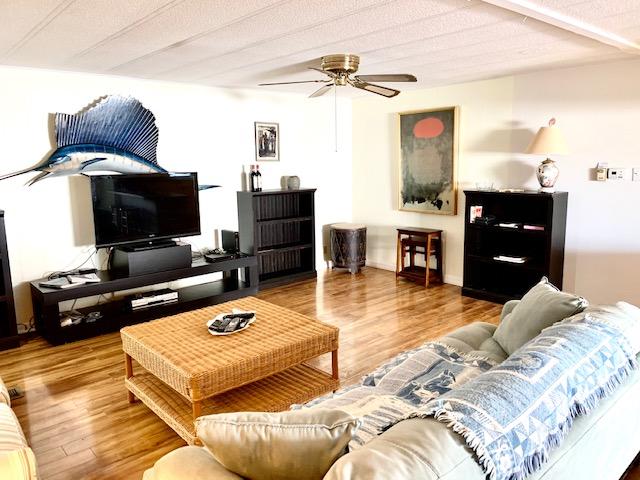 702 North Silver Circle Key Largo, FL 33037 - Photo 6 of 38 a bedroom with a bed and a flat tv screen on dresser