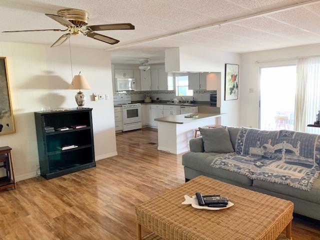 702 North Silver Circle Key Largo, FL 33037 - Photo 8 of 38 a living room with furniture and a fireplace