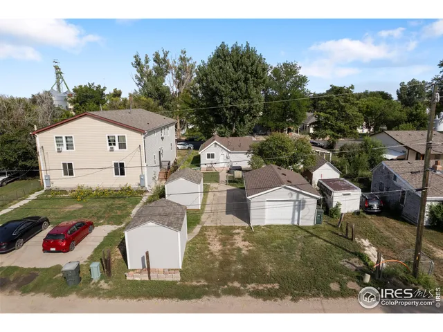 a view of house with backyard
