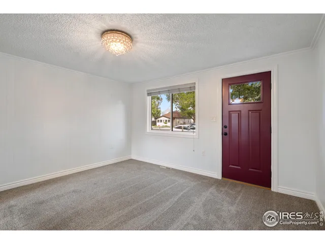 a view of an empty room and window