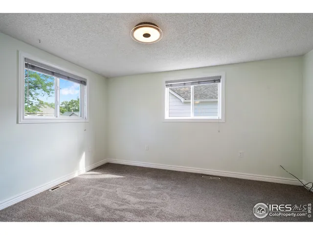 a kitchen with a refrigerator and a sink