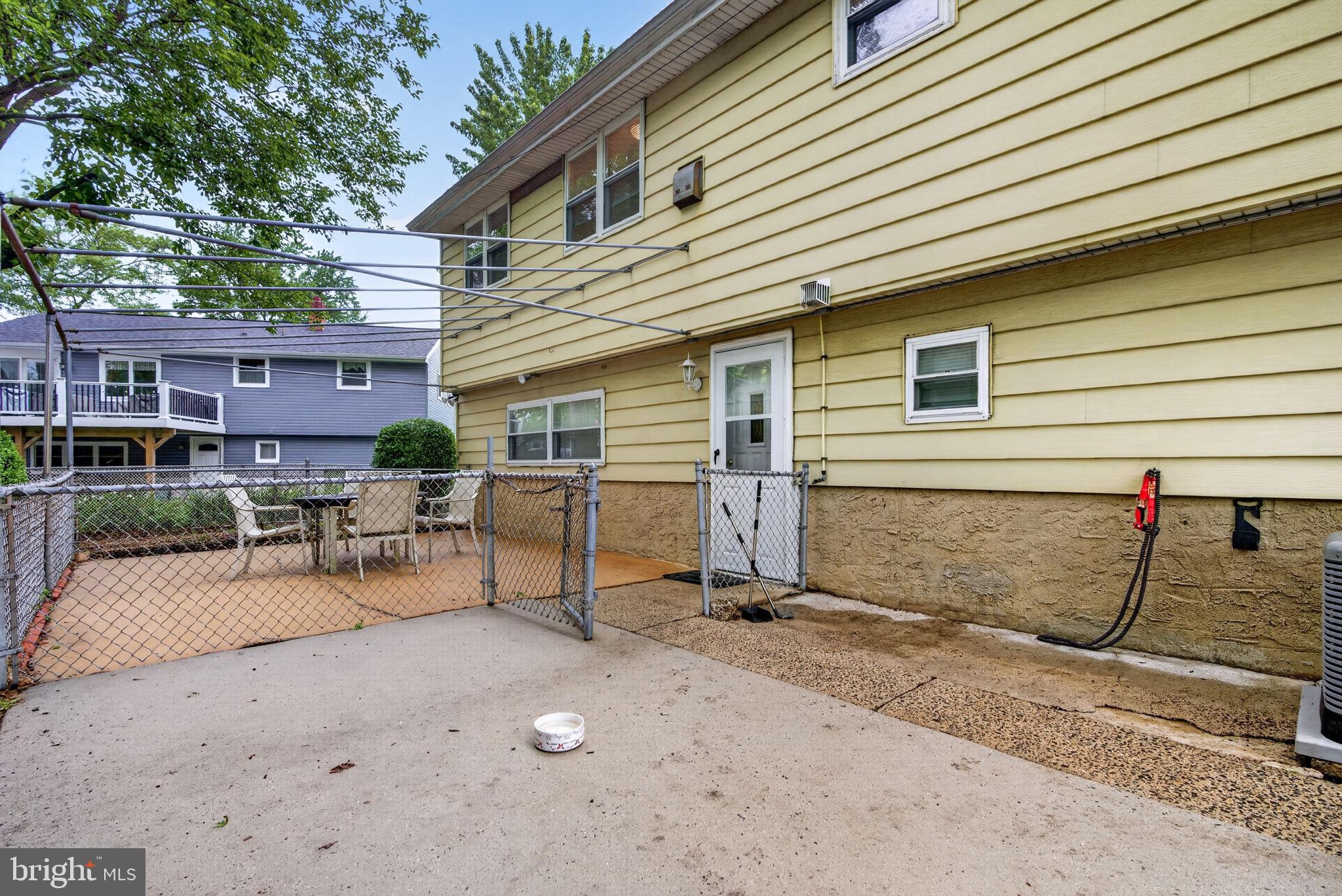 46 Trinity Avenue Marlton, NJ 08053 - Photo 34 of 37 a view of backyard with table and chairs and wooden fence