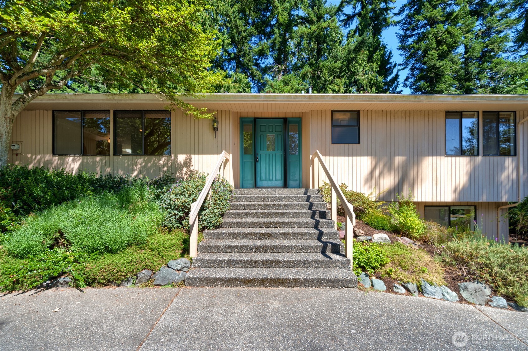 front view of a house with a yard