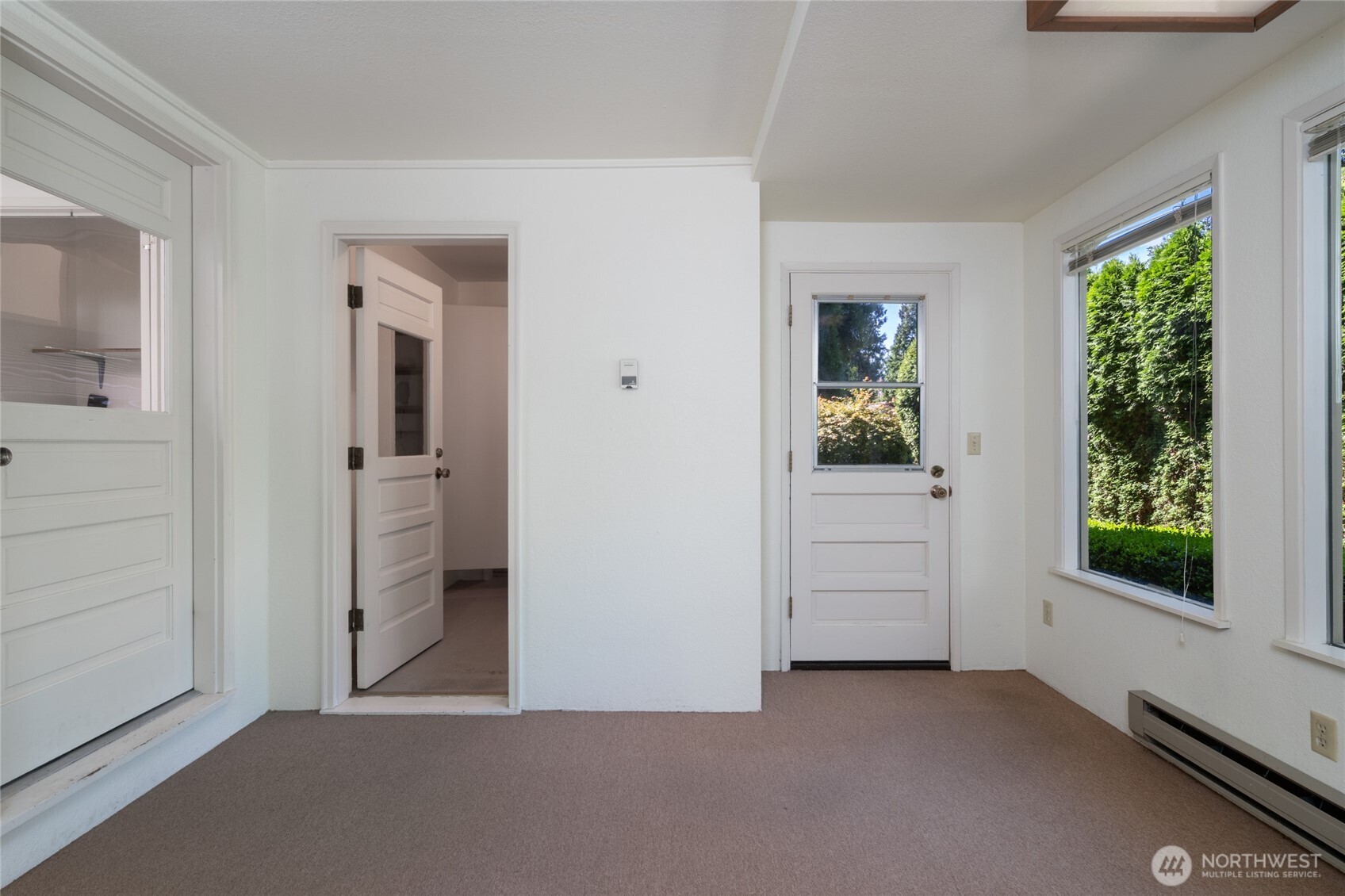 379 Snohomish Drive La Conner, WA 98257 - Photo 19 of 40 wooden floor and windows in a room