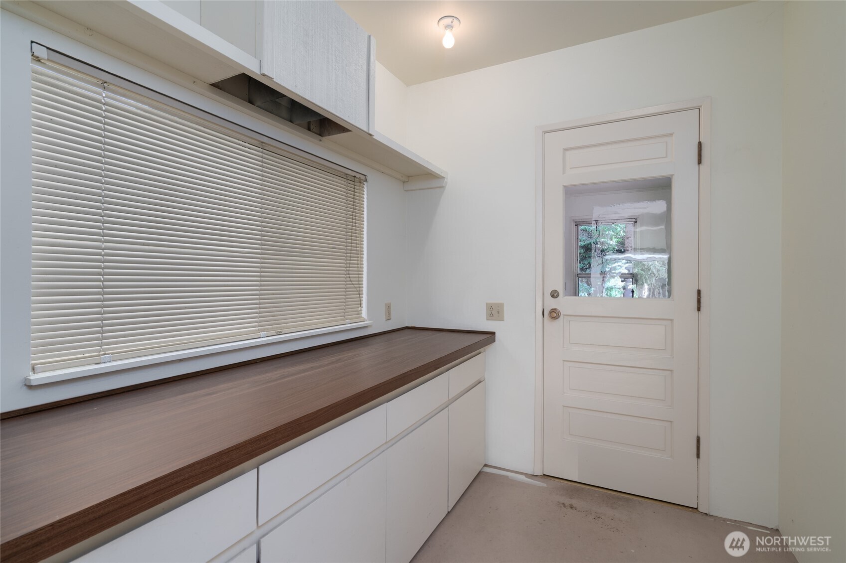 379 Snohomish Drive La Conner, WA 98257 - Photo 20 of 40 a kitchen with a sink and cabinets