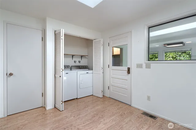 wooden floor with white cabinets