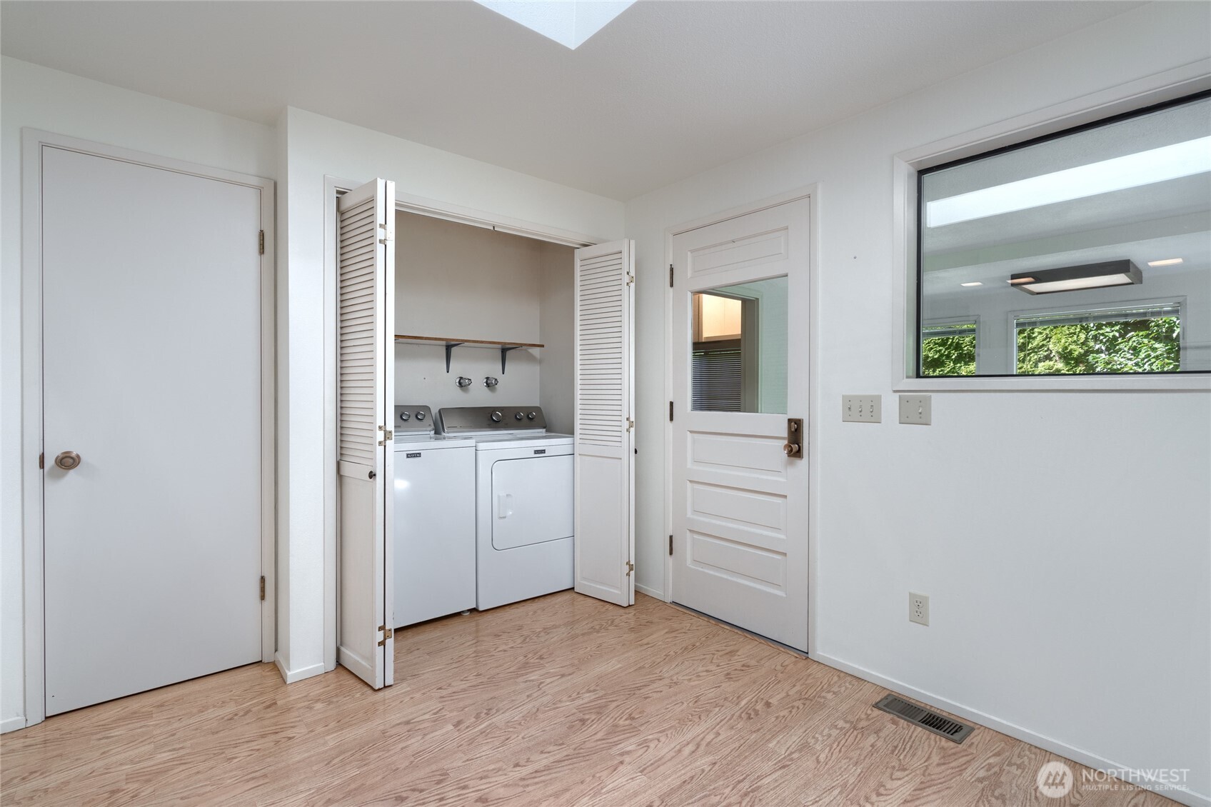 379 Snohomish Drive La Conner, WA 98257 - Photo 21 of 40 wooden floor with white cabinets
