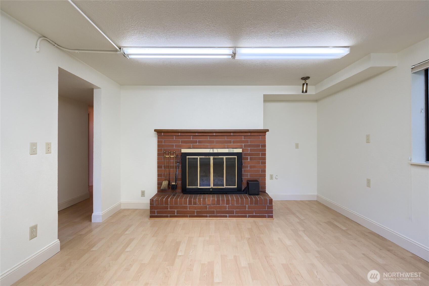 379 Snohomish Drive La Conner, WA 98257 - Photo 24 of 40 a view of an empty room with a fireplace