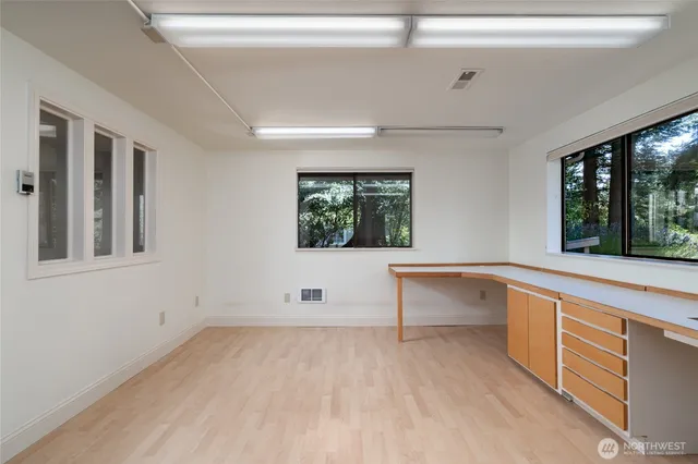 a view of room with window and furniture