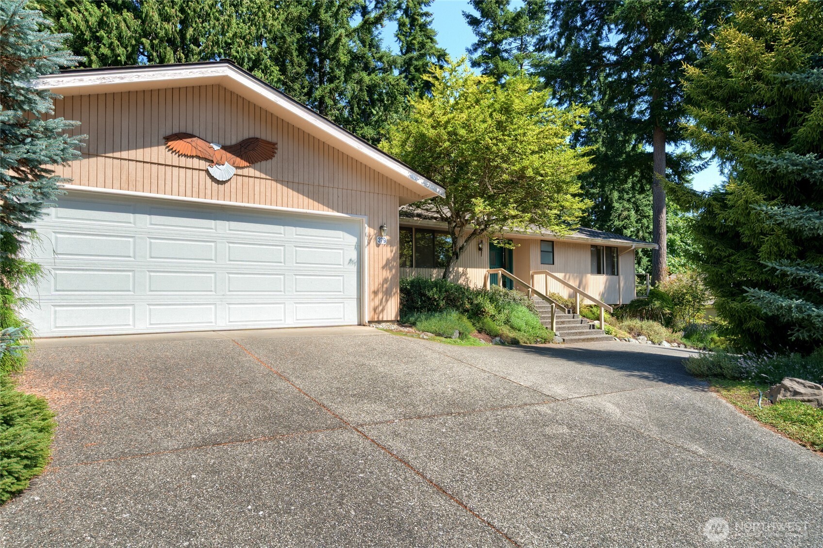 379 Snohomish Drive La Conner, WA 98257 - Photo 3 of 40 a backyard of a house with potted plants