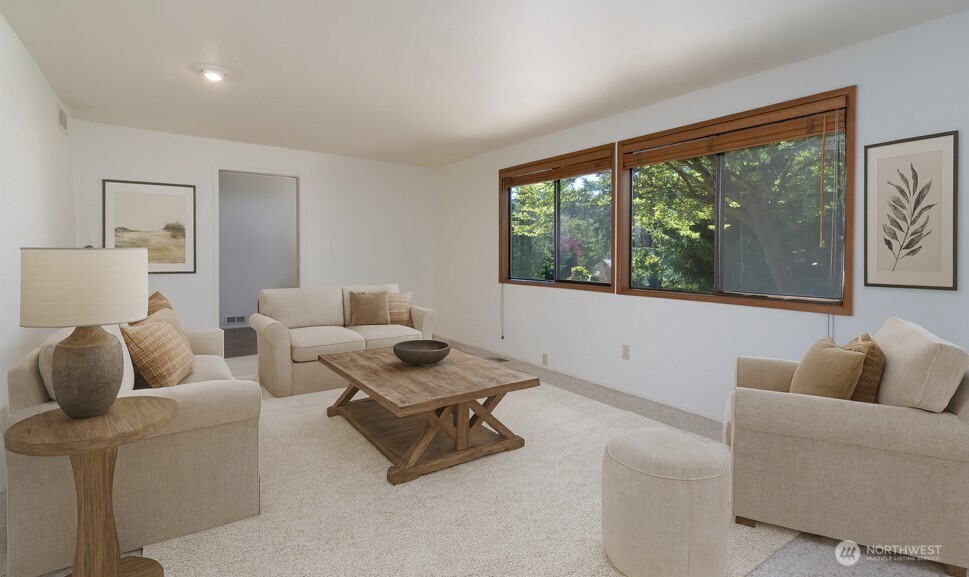 379 Snohomish Drive La Conner, WA 98257 - Photo 10 of 40 a living room with furniture and a floor to ceiling window