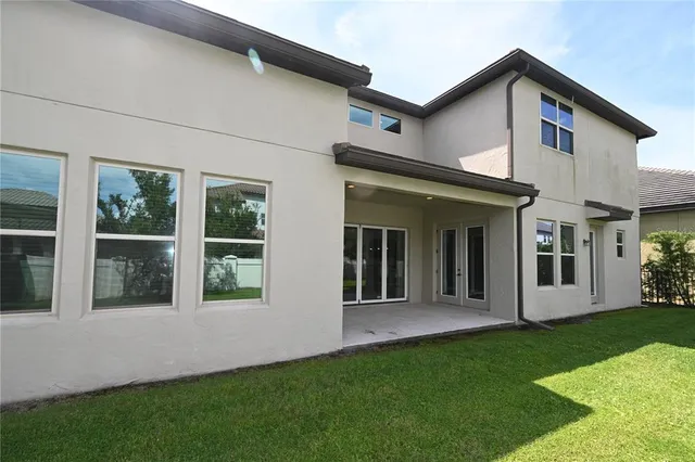 a view of empty room with ceiling fan