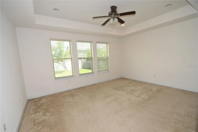 a spacious bathroom with a granite countertop sink and a mirror