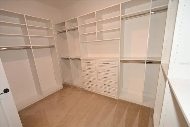 a large kitchen with stainless steel appliances granite countertop a large counter top and stove