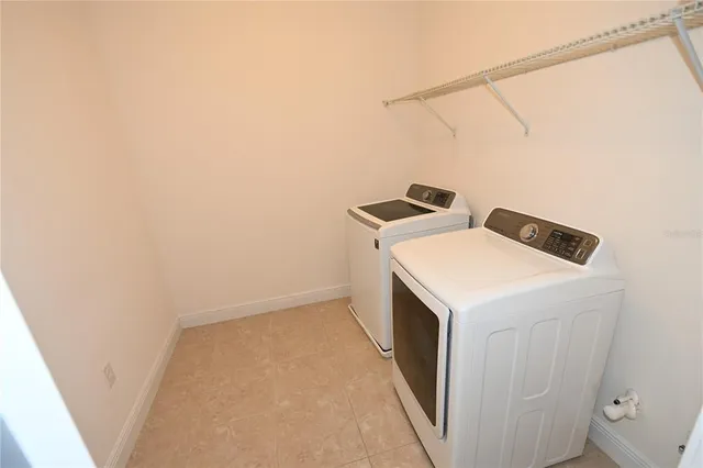 an empty room with closet and wooden door
