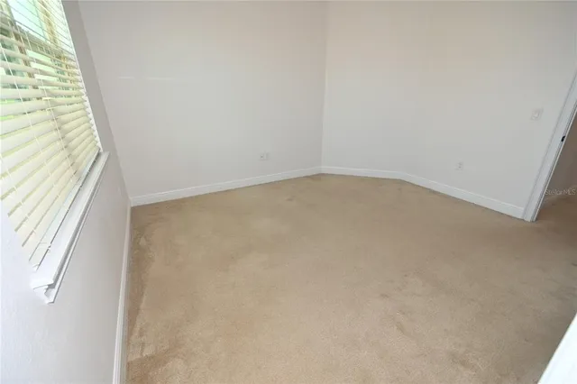 a view of a swimming pool with outdoor seating