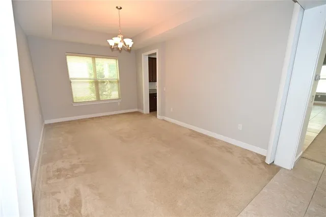 a kitchen with stainless steel appliances granite countertop a refrigerator and a wooden cabinets