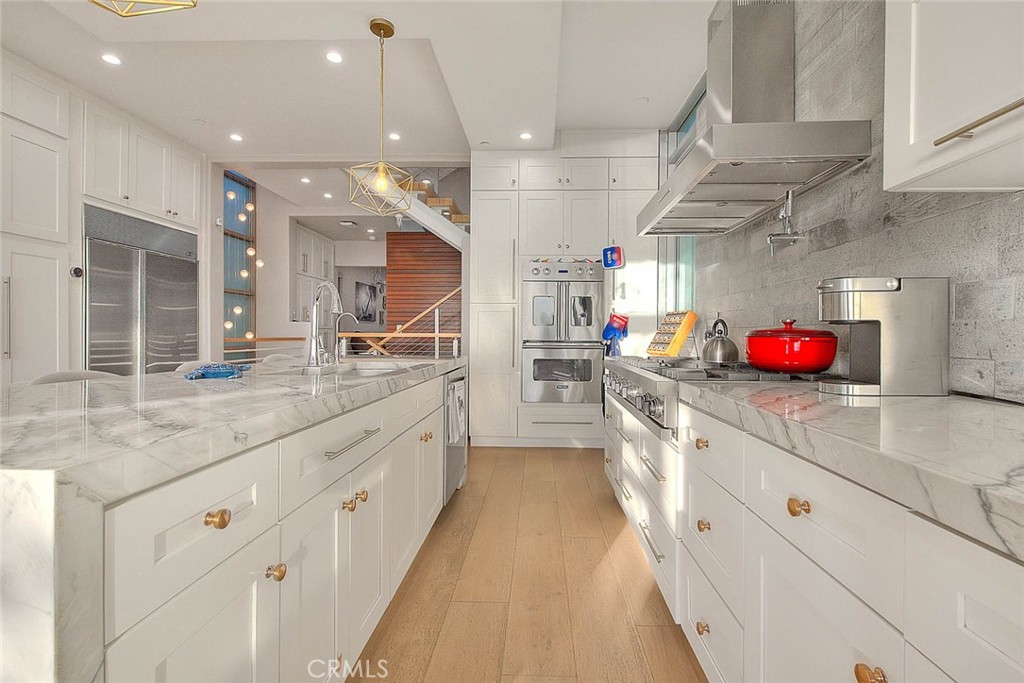99 A Surfside Avenue Surfside, CA 90743 - Photo 22 of 75 a large kitchen with lots of counter space and a sink