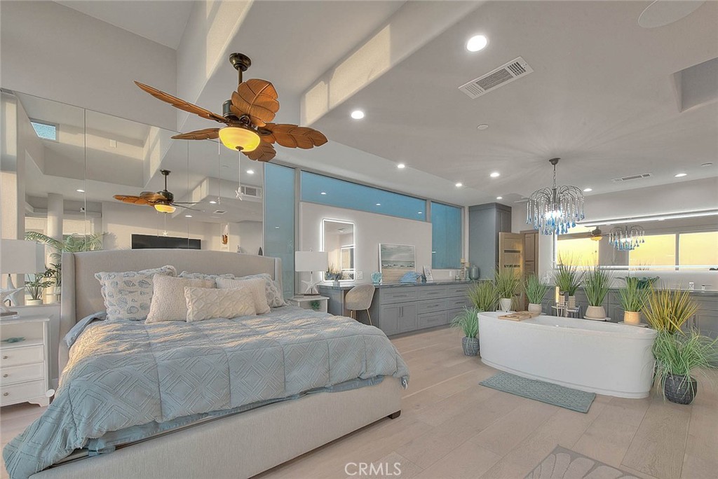 99 A Surfside Avenue Surfside, CA 90743 - Photo 33 of 75 a bedroom with a large bed and a chandelier
