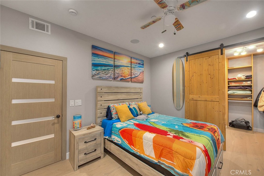 99 A Surfside Avenue Surfside, CA 90743 - Photo 43 of 75 a bedroom with a bed and a cabinet
