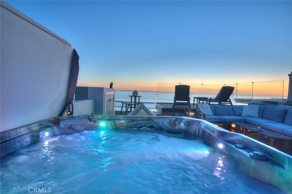 99 A Surfside Avenue Surfside, CA 90743 - Photo 55 of 75 a view of a terrace with a table and chairs