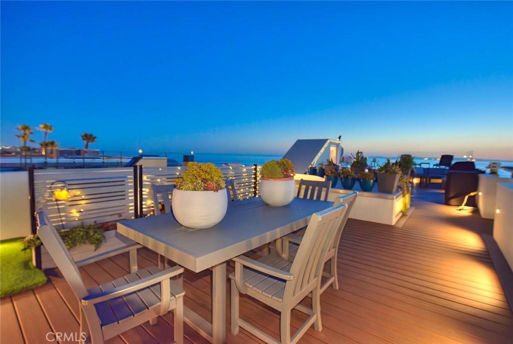 99 A Surfside Avenue Surfside, CA 90743 - Photo 59 of 75 a view of a dining room with furniture and wooden floor