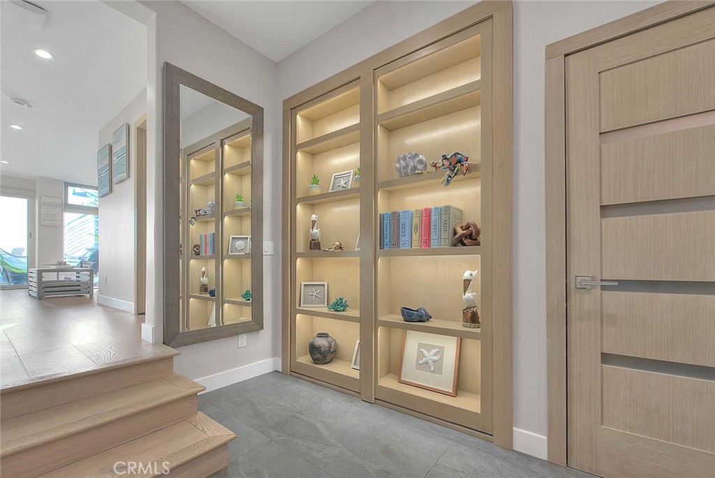 99 A Surfside Avenue Surfside, CA 90743 - Photo 10 of 75 a view of a hallway with bathroom and glass door