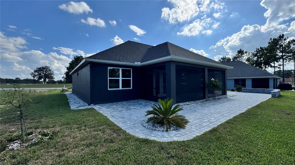 17665 Southwest 61st Ln Road Dunnellon, FL 34432 - Photo 30 of 32 a front view of a house with a yard