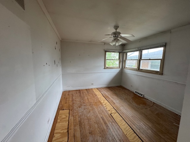 8135 West Rascher Avenue Chicago, IL 60656 - Photo 7 of 11 wooden floor in an empty room with a window