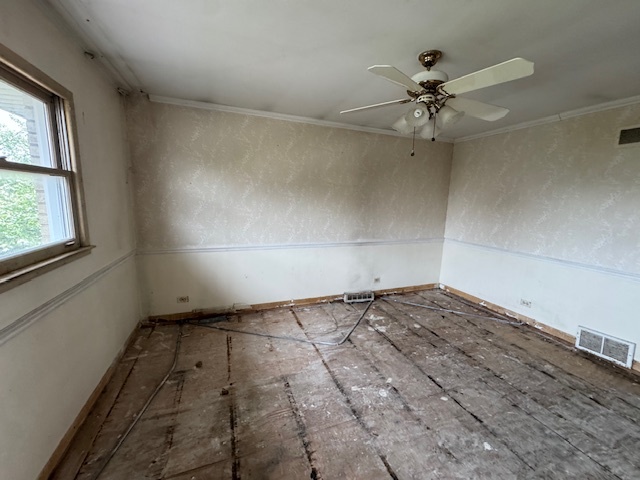 8135 West Rascher Avenue Chicago, IL 60656 - Photo 9 of 11 an empty room with windows and fan