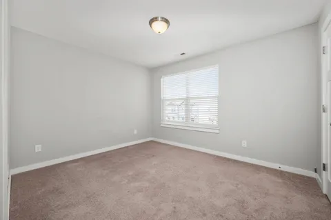 an empty room with a bathroom